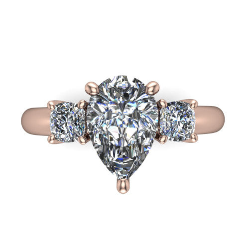 Penelope pear three stone engagement ring in 18K Rose Gold, top-down view showing the brilliant pear-cut center diamond, two matched pear-cut side diamonds aligned across the band