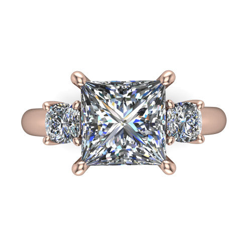 Penelope princess three stone engagement ring in 18K Rose Gold, top-down view showing the brilliant princess-cut center diamond, two matched princess-cut side diamonds aligned across the band