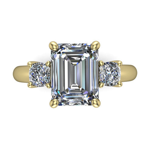 Penelope emerald three stone engagement ring in 14K Yellow Gold, top-down view showing the step-cut emerald center diamond, two matched step-cut emerald side diamonds aligned across the band