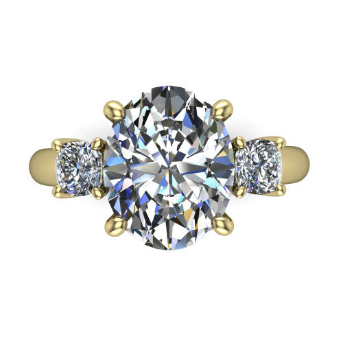 Penelope oval three stone engagement ring in 18K Yellow Gold, top-down view showing the brilliant oval center diamond, two matched oval side diamonds aligned across the band