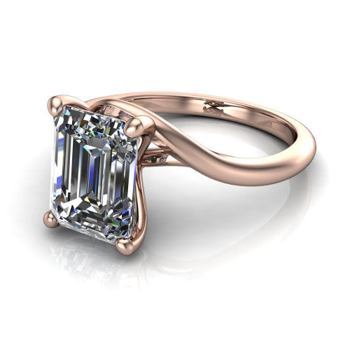 Awren emerald solitaire engagement ring in 14K Rose Gold, three-quarter perspective showing the step-cut emerald center diamond on a bypass crossover shank