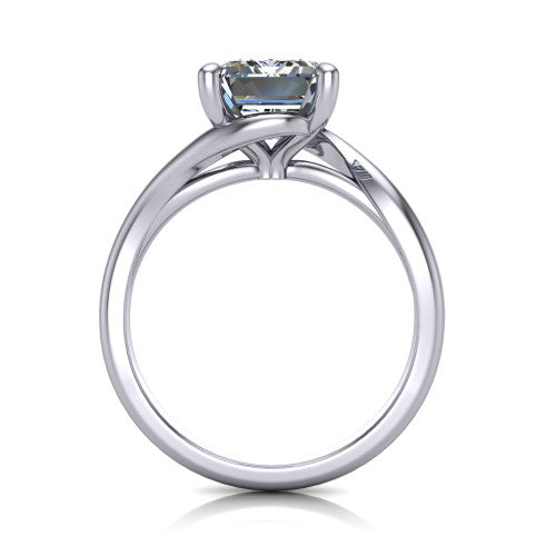 Awren emerald solitaire engagement ring in Platinum, through-finger front profile showing the bypass arms crossing beneath the head and open under-gallery