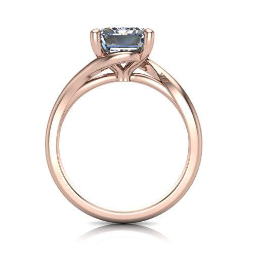 Awren emerald solitaire engagement ring in 18K Rose Gold, through-finger front profile showing the bypass arms crossing beneath the head and open under-gallery