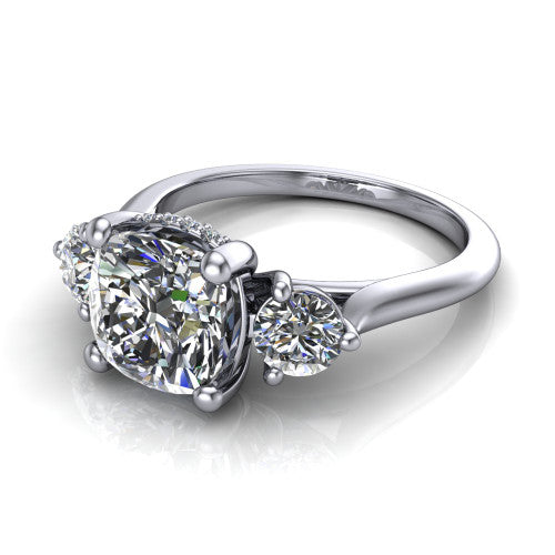 Edith cushion hidden halo engagement ring in 18K White Gold, three-quarter perspective showing the brilliant cushion-cut center diamond flanked by two round side diamonds with a hidden pave halo beneath the center stone