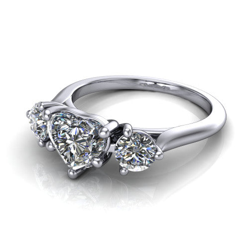 Edith heart hidden halo engagement ring in Platinum, three-quarter perspective showing the brilliant heart-shaped center diamond flanked by two round side diamonds with a hidden pave halo beneath the center stone