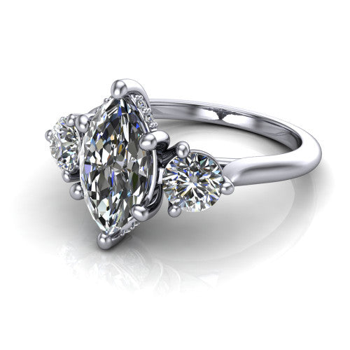 Edith marquise hidden halo engagement ring in Platinum, three-quarter perspective showing the brilliant marquise center diamond flanked by two round side diamonds with a hidden pave halo beneath the center stone