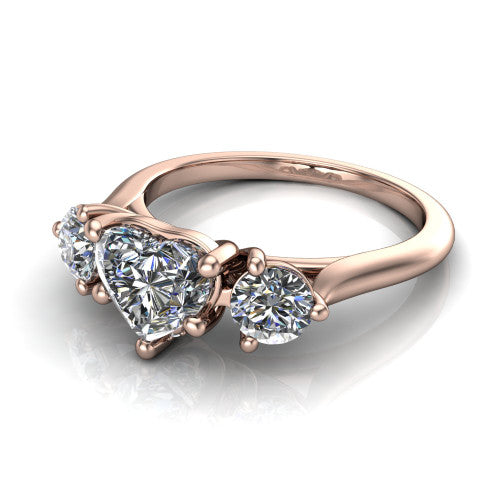 Edith heart hidden halo engagement ring in 18K Rose Gold, three-quarter perspective showing the brilliant heart-shaped center diamond flanked by two round side diamonds with a hidden pave halo beneath the center stone