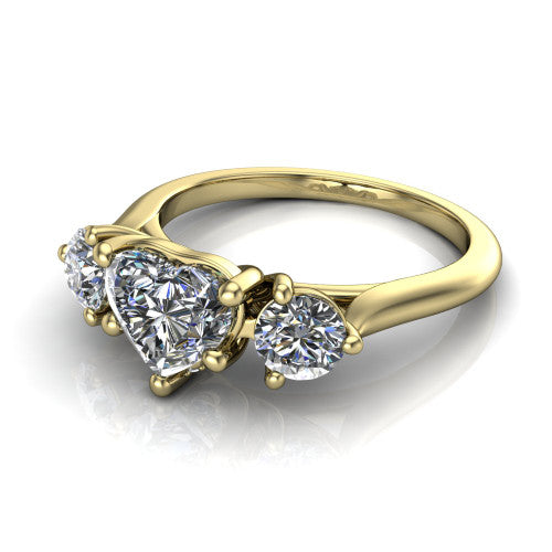Edith heart hidden halo engagement ring in 14K Yellow Gold, three-quarter perspective showing the brilliant heart-shaped center diamond flanked by two round side diamonds with a hidden pave halo beneath the center stone