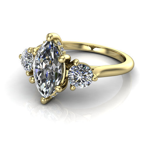 Edith marquise hidden halo engagement ring in 14K Yellow Gold, three-quarter perspective showing the brilliant marquise center diamond flanked by two round side diamonds with a hidden pave halo beneath the center stone