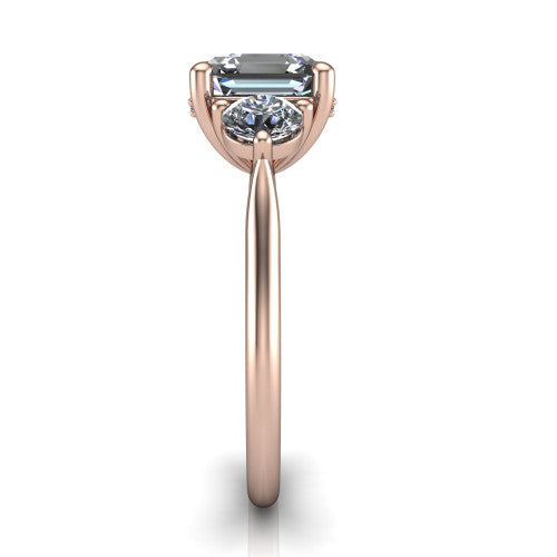 Edith square emerald hidden halo engagement ring in 18K Rose Gold, side profile showing the tall basket, hidden pave halo beneath the center stone, and slim polished band