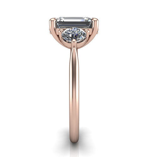 Edith emerald hidden halo engagement ring in 18K Rose Gold, side profile showing the tall basket, hidden pave halo beneath the center stone, and slim polished band