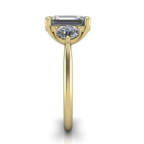 Edith emerald hidden halo engagement ring in 14K Yellow Gold, side profile showing the tall basket, hidden pave halo beneath the center stone, and slim polished band