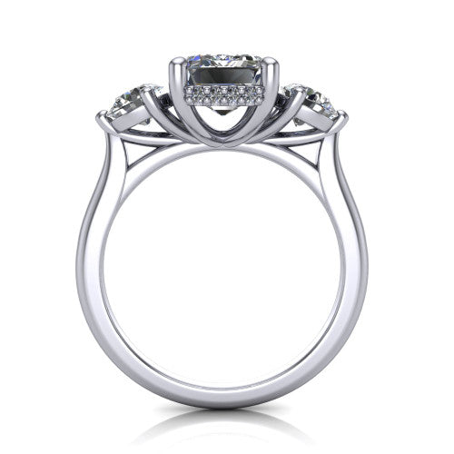Edith emerald hidden halo engagement ring in 18K White Gold, through-finger front profile showing the three-stone head and tall basket with hidden halo visible from the side