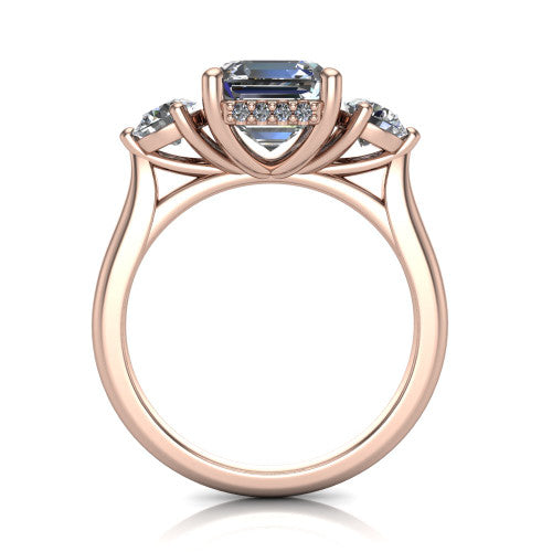 Edith square emerald hidden halo engagement ring in 14K Rose Gold, through-finger front profile showing the three-stone head and tall basket with hidden halo visible from the side