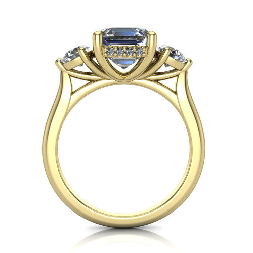 Edith square emerald hidden halo engagement ring in 18K Yellow Gold, through-finger front profile showing the three-stone head and tall basket with hidden halo visible from the side