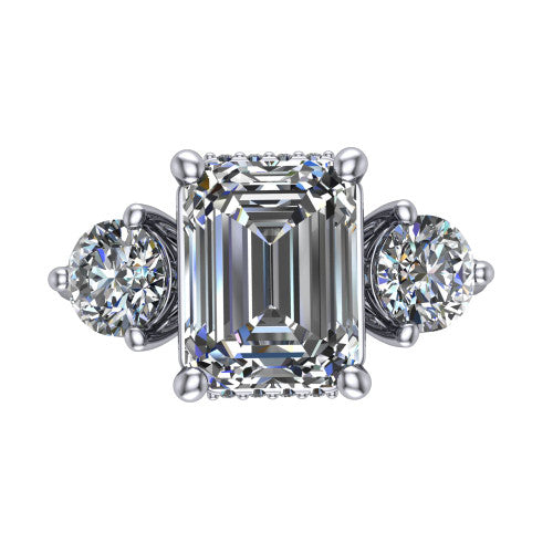 Edith emerald hidden halo engagement ring in 18K White Gold, top-down view showing the step-cut emerald center diamond with two matched round side diamonds and the hidden pave halo peeking from beneath