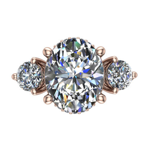 Edith oval hidden halo engagement ring in 14K Rose Gold, top-down view showing the brilliant oval center diamond with two matched round side diamonds and the hidden pave halo peeking from beneath