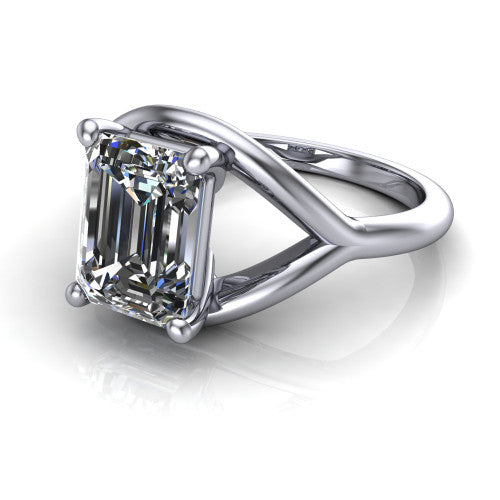 Margot emerald solitaire engagement ring in 18K White Gold, three-quarter perspective showing the step-cut emerald center diamond on a marquise leaf split shank