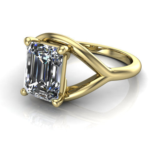 Margot emerald solitaire engagement ring in 14K Yellow Gold, three-quarter perspective showing the step-cut emerald center diamond on a marquise leaf split shank