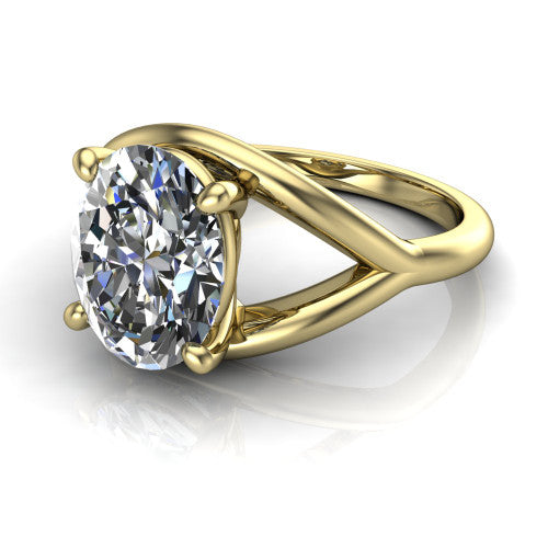 Margot oval solitaire engagement ring in 14K Yellow Gold, three-quarter perspective showing the brilliant oval center diamond on a marquise leaf split shank