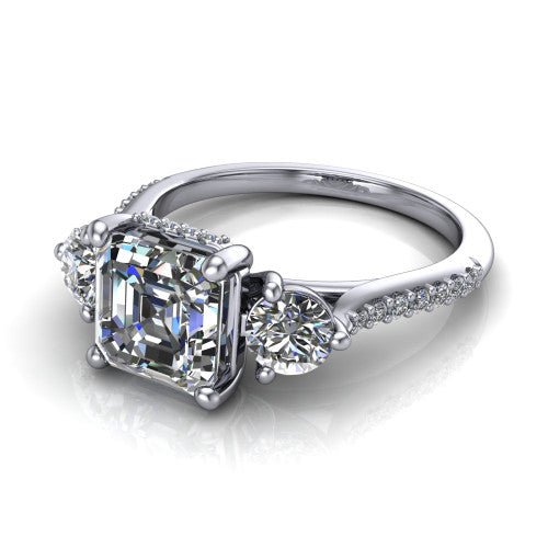 Phoebe asscher hidden halo engagement ring in Platinum, three-quarter perspective showing the center diamond between two round side stones above a pav&eacute; shank