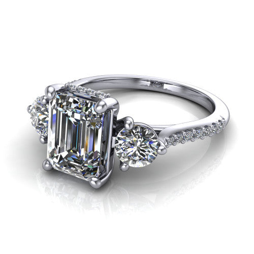 Phoebe emerald hidden halo engagement ring in 14K White Gold, three-quarter perspective showing the center diamond between two round side stones above a pav&eacute; shank