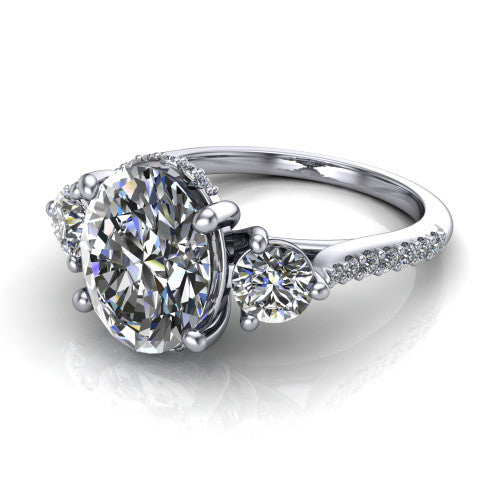 Phoebe oval hidden halo engagement ring in 18K White Gold, three-quarter perspective showing the center diamond between two round side stones above a pav&eacute; shank