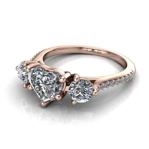 Phoebe heart hidden halo engagement ring in 14K Rose Gold, three-quarter perspective showing the center diamond between two round side stones above a pav&eacute; shank