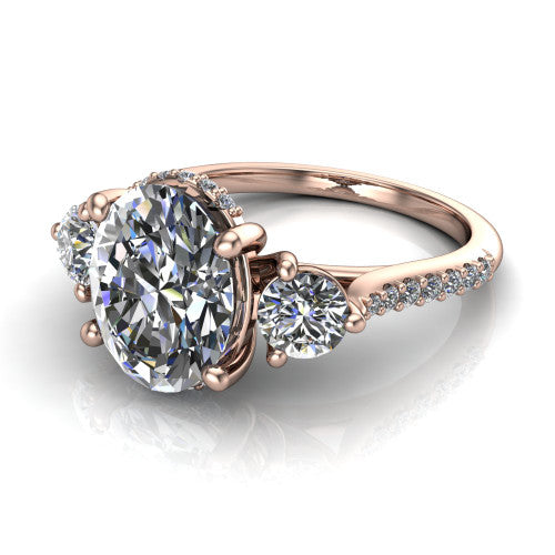 Phoebe oval hidden halo engagement ring in 14K Rose Gold, three-quarter perspective showing the center diamond between two round side stones above a pav&eacute; shank