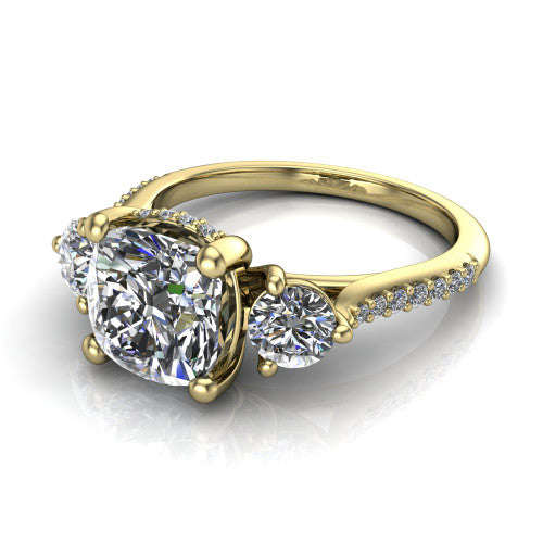 Phoebe cushion hidden halo engagement ring in 14K Yellow Gold, three-quarter perspective showing the center diamond between two round side stones above a pav&eacute; shank