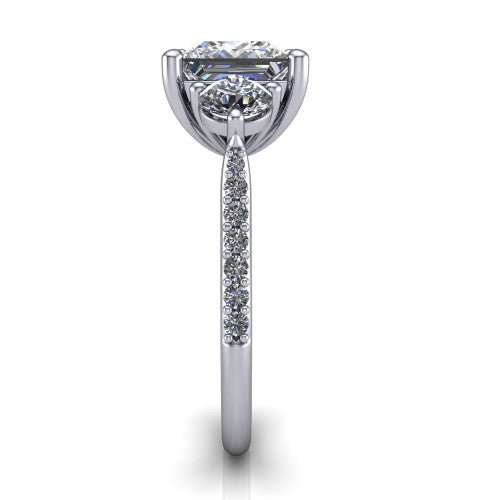 Phoebe princess hidden halo engagement ring in Platinum, side profile showing the hidden halo beneath the center and the pav&eacute; diamonds down the shank