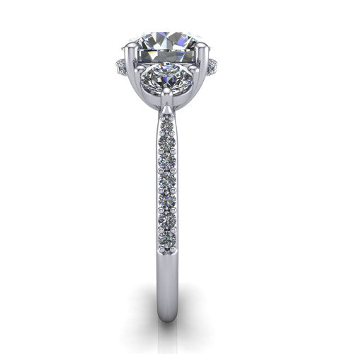 Phoebe round hidden halo engagement ring in 14K White Gold, side profile showing the hidden halo beneath the center and the pav&eacute; diamonds down the shank