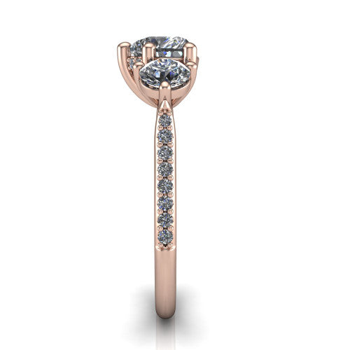 Phoebe heart hidden halo engagement ring in 18K Rose Gold, side profile showing the hidden halo beneath the center and the pav&eacute; diamonds down the shank