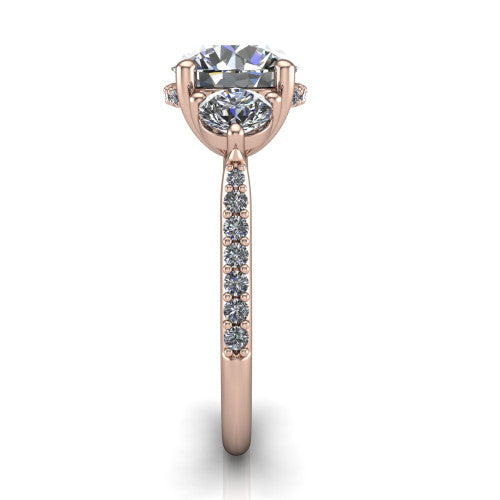 Phoebe round hidden halo engagement ring in 18K Rose Gold, side profile showing the hidden halo beneath the center and the pav&eacute; diamonds down the shank