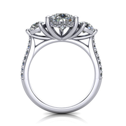 Phoebe pear hidden halo engagement ring in Platinum, through-finger front profile showing the three-stone head raised above the pav&eacute; band