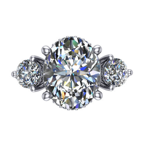 Phoebe oval hidden halo engagement ring in Platinum, top-down view showing the center diamond flanked by two round side stones over a hidden halo