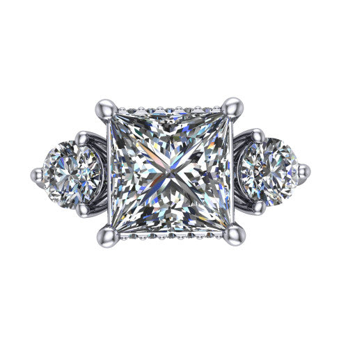 Phoebe princess hidden halo engagement ring in Platinum, top-down view showing the center diamond flanked by two round side stones over a hidden halo