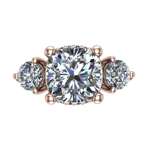 Phoebe cushion hidden halo engagement ring in 18K Rose Gold, top-down view showing the center diamond flanked by two round side stones over a hidden halo
