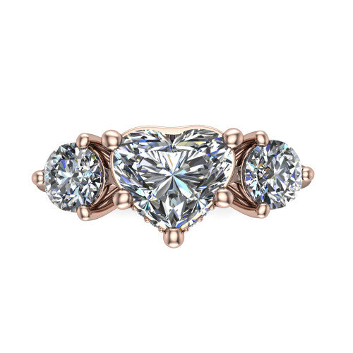 Phoebe heart hidden halo engagement ring in 18K Rose Gold, top-down view showing the center diamond flanked by two round side stones over a hidden halo