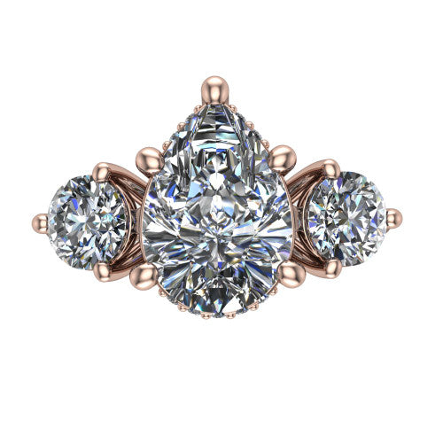 Phoebe pear hidden halo engagement ring in 14K Rose Gold, top-down view showing the center diamond flanked by two round side stones over a hidden halo