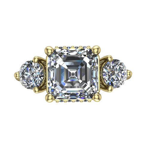 Phoebe asscher hidden halo engagement ring in 18K Yellow Gold, top-down view showing the center diamond flanked by two round side stones over a hidden halo