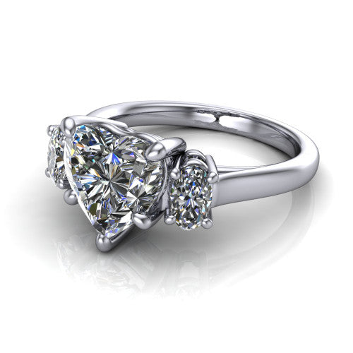 Imogen heart three stone engagement ring in 14K White Gold, three-quarter perspective showing the center diamond between two round side stones on a slim polished band
