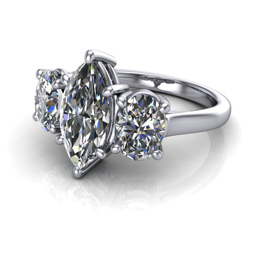 Imogen marquise three stone engagement ring in 14K White Gold, three-quarter perspective showing the center diamond between two round side stones on a slim polished band