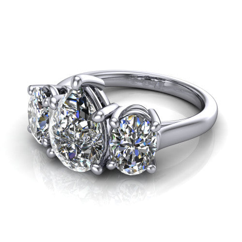 Imogen pear three stone engagement ring in 14K White Gold, three-quarter perspective showing the center diamond between two round side stones on a slim polished band