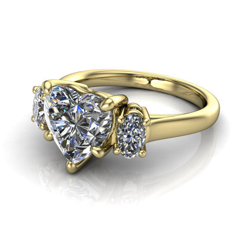 Imogen heart three stone engagement ring in 14K Yellow Gold, three-quarter perspective showing the center diamond between two round side stones on a slim polished band