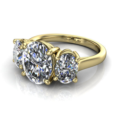 Imogen oval three stone engagement ring in 14K Yellow Gold, three-quarter perspective showing the center diamond between two round side stones on a slim polished band