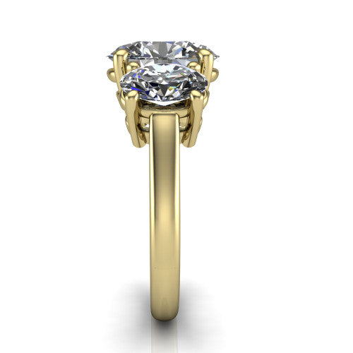 Imogen oval three stone engagement ring in 18K Yellow Gold, side profile showing the round side stone and the smooth tapered polished band