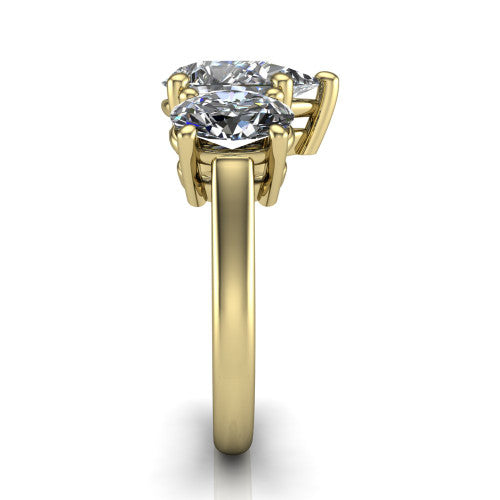 Imogen pear three stone engagement ring in 14K Yellow Gold, side profile showing the round side stone and the smooth tapered polished band
