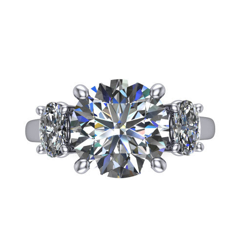 Imogen round three stone engagement ring in 18K White Gold, top-down view showing the center diamond flanked by two round side stones in a classic three stone setting