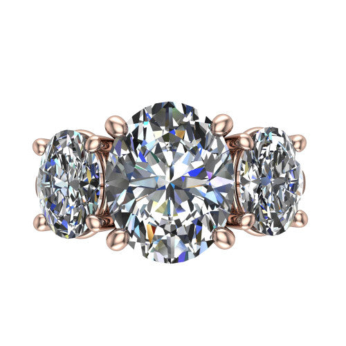 Imogen oval three stone engagement ring in 14K Rose Gold, top-down view showing the center diamond flanked by two round side stones in a classic three stone setting